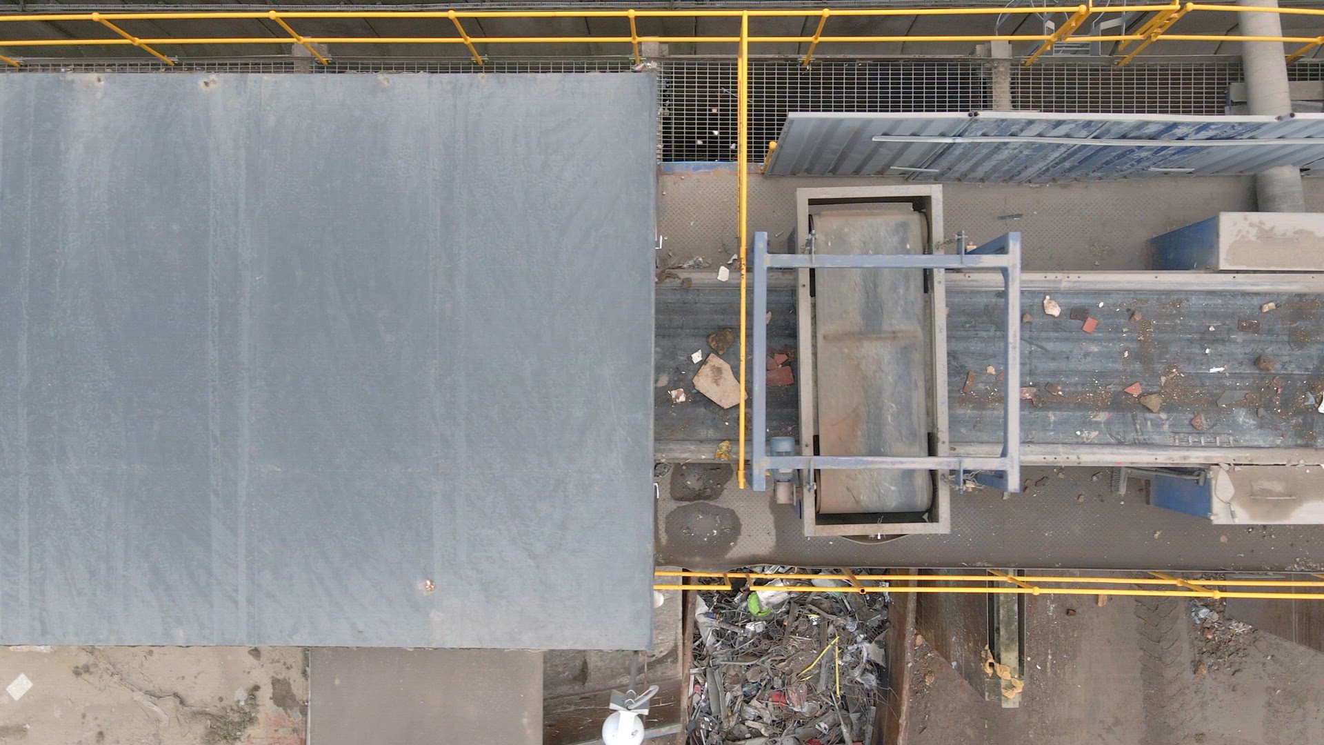 Waste Moving Through a Recycling Plant Belt