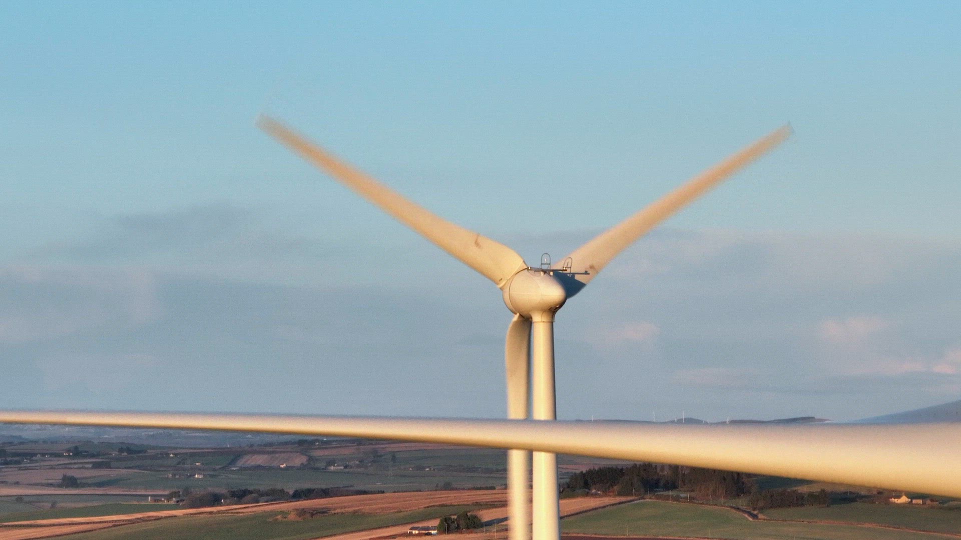 Wind Turbines at Sunset Generating Renewable Energy