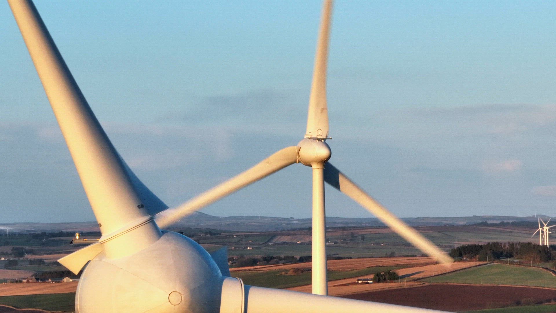 Wind Turbines at Sunset Generating Renewable Energy