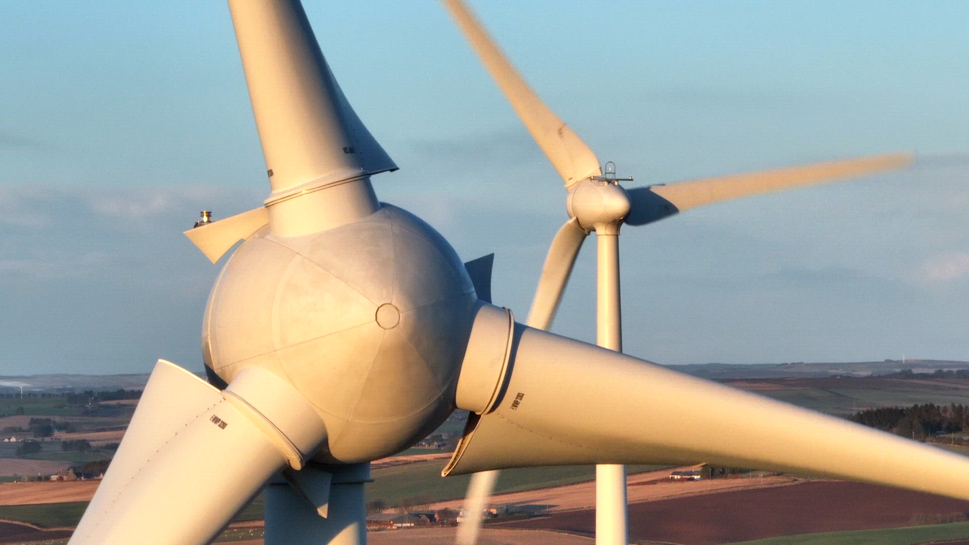 Wind Turbines at Sunset Generating Renewable Energy