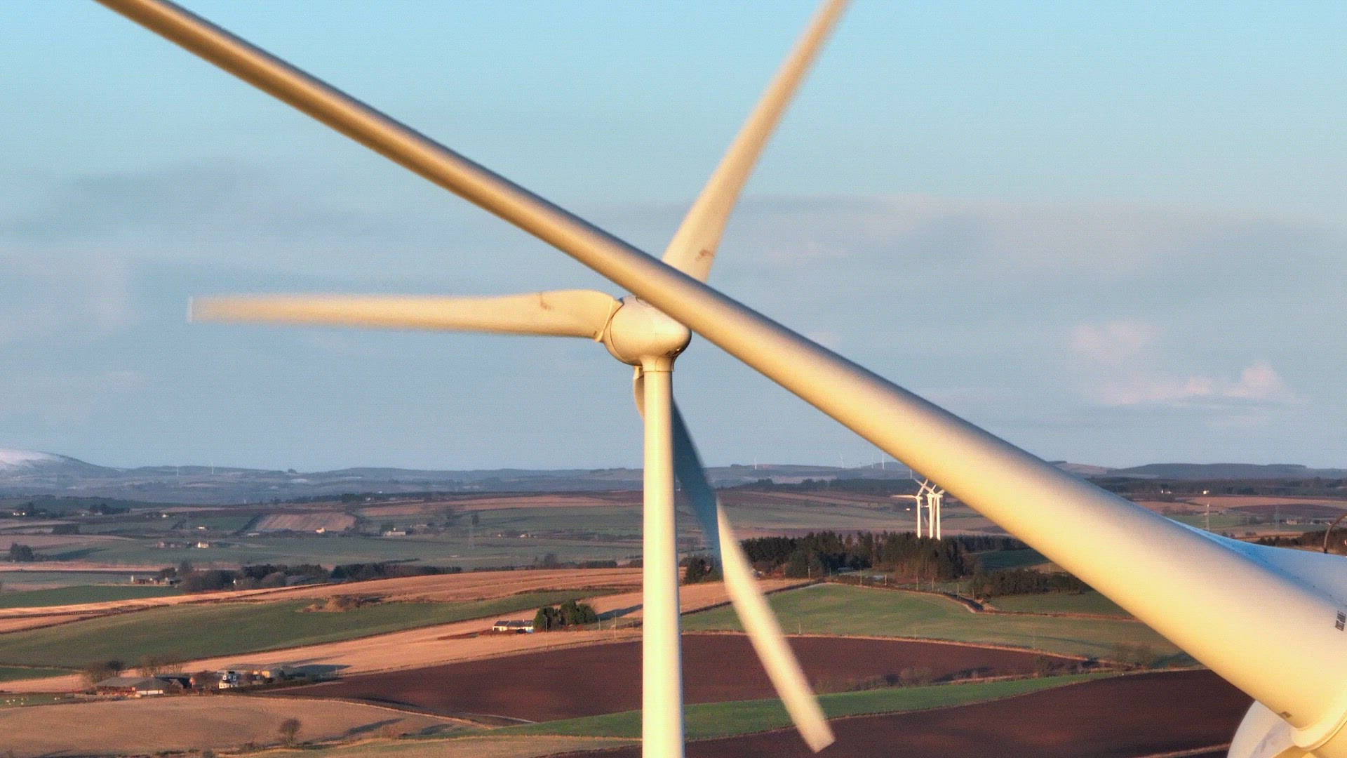Wind Farm Turbines at Sunset Generating Renewable Power