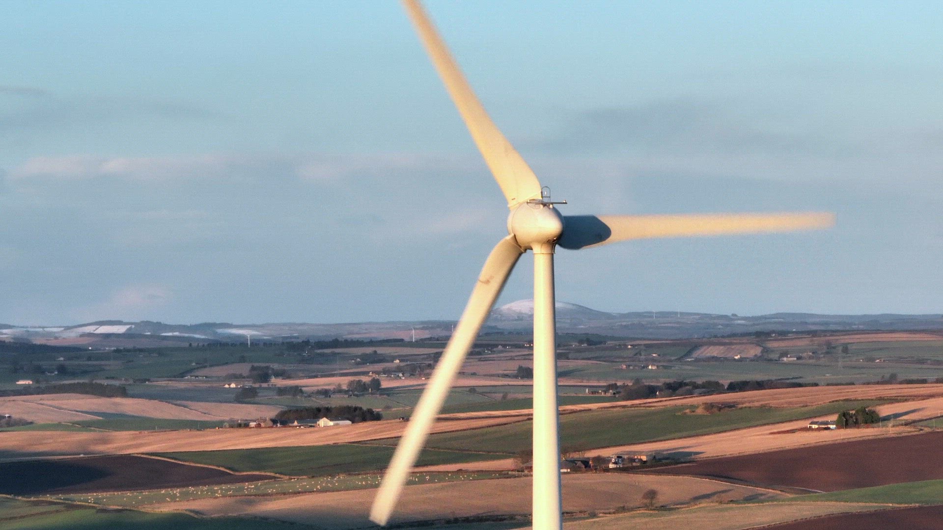 Wind Farm Turbines at Sunset Generating Renewable Power