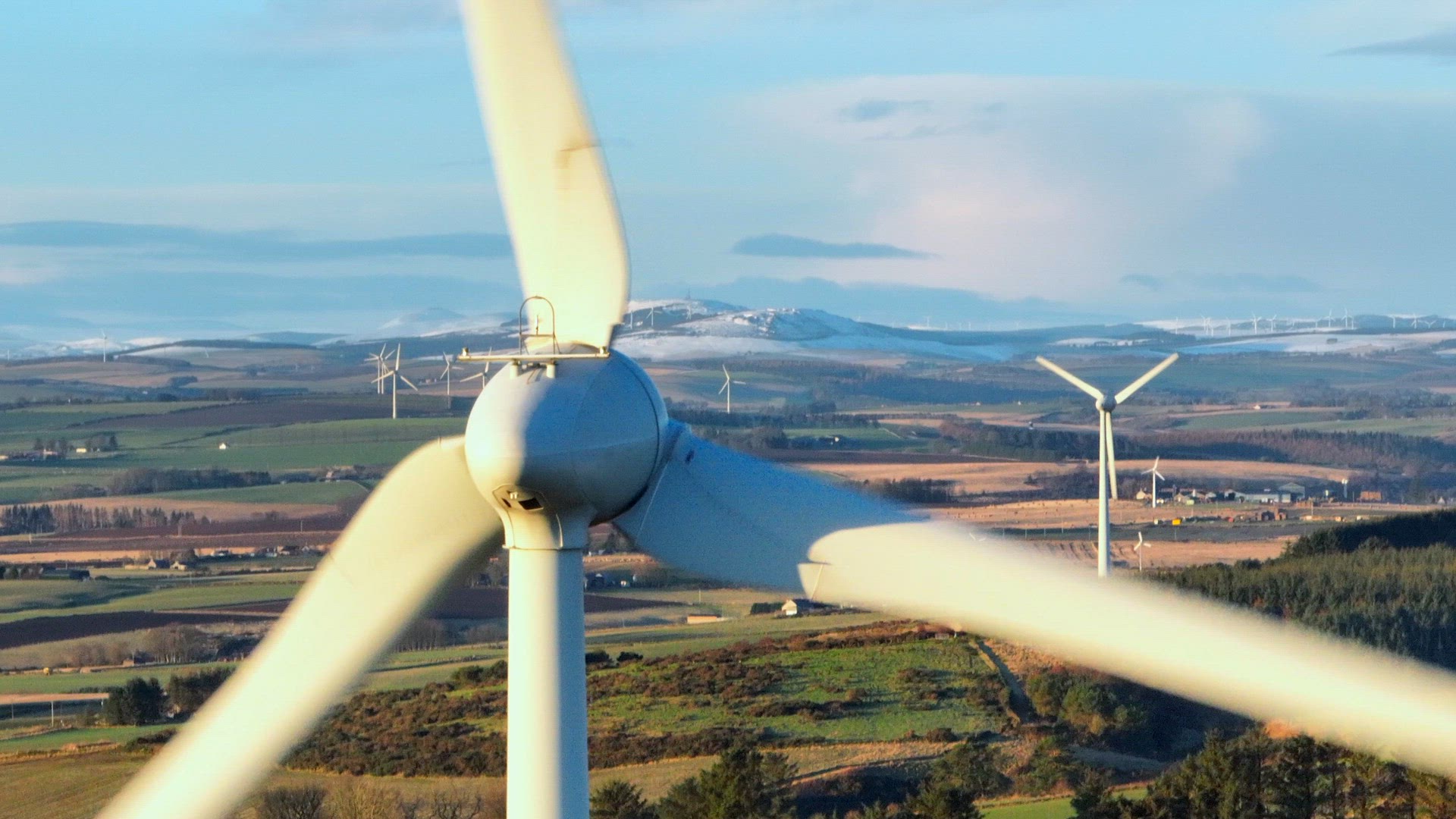 Wind Farm Turbines at Sunset Generating Renewable Power