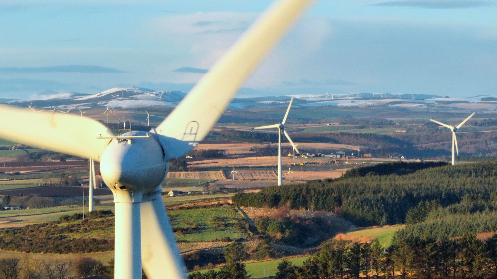 Wind Farm Turbines at Sunset Generating Renewable Power