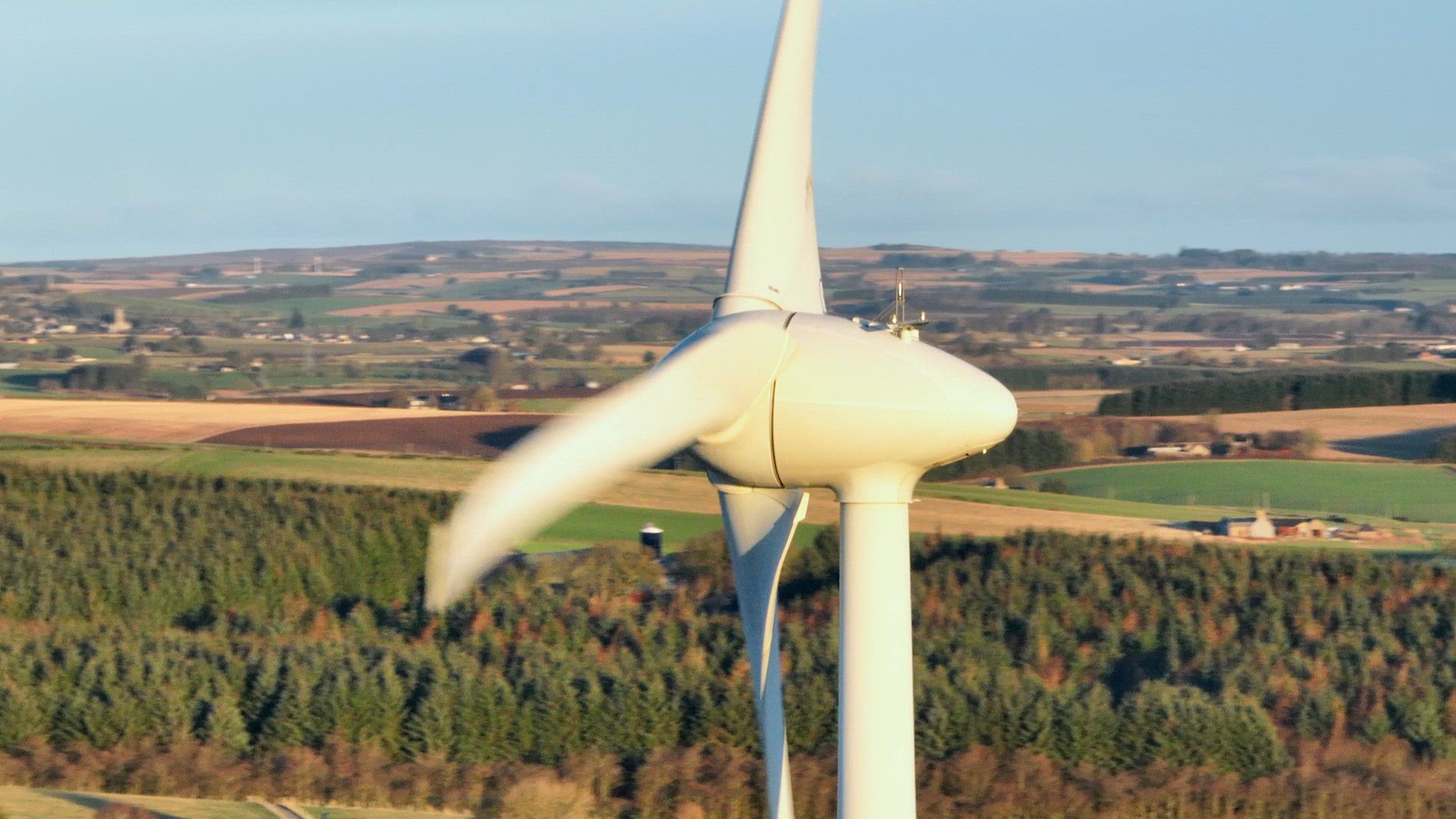 Wind Turbine at Sunset Generating Renewable Energy