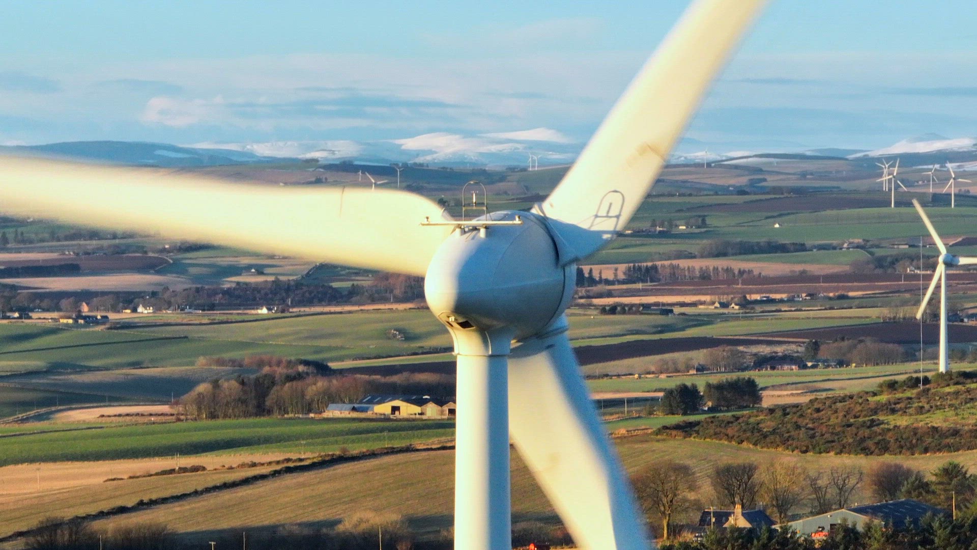 Wind Farm Turbines at Sunset Generating Renewable Power