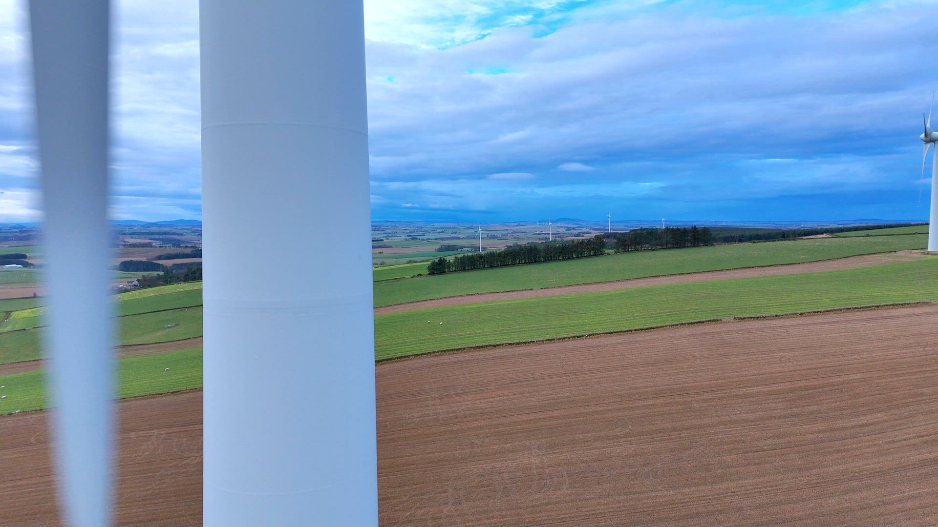 Close Up Aerial View of a Large Wind Farm Turbine