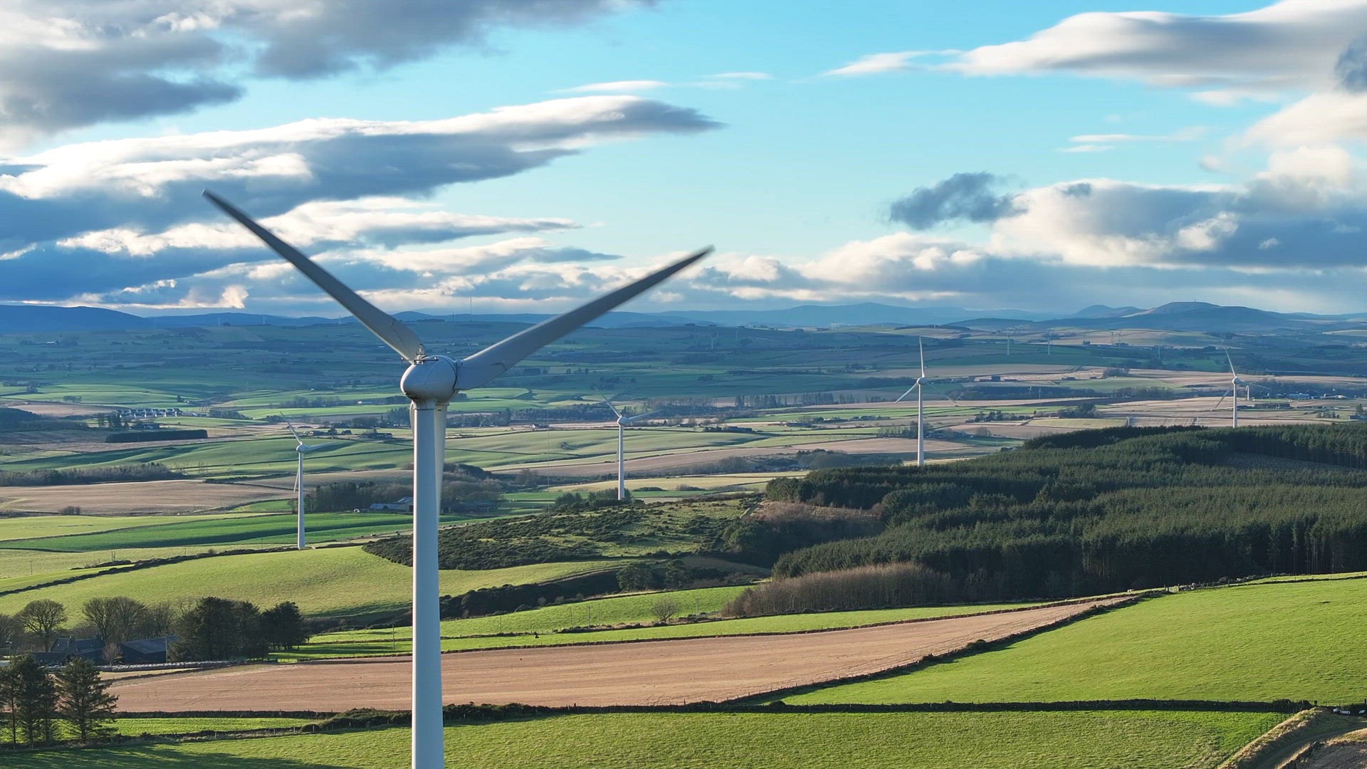 Wind Farm Turbines Generating Green Renewable Energy Aerial View