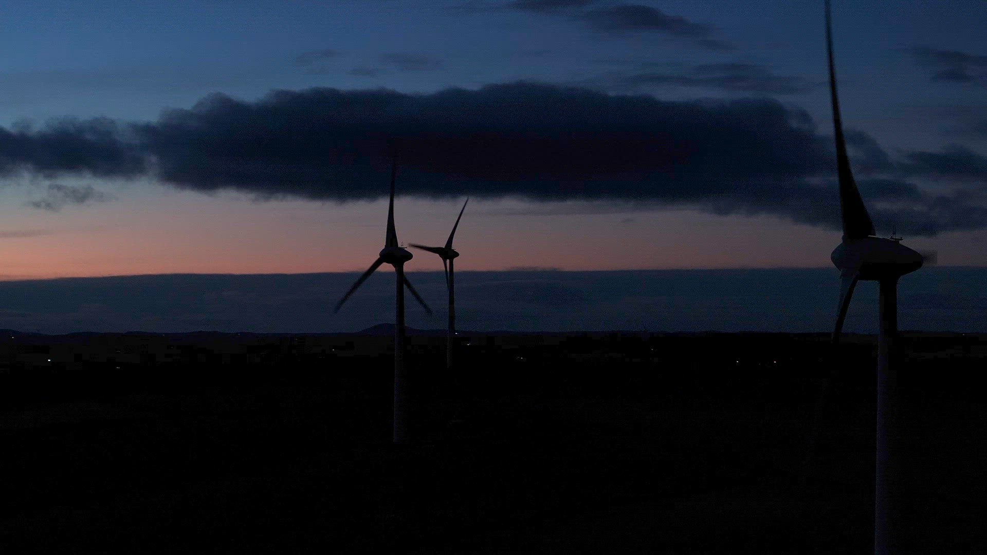 Wind Farm Turbines Generating Renewable Energy Through the Night