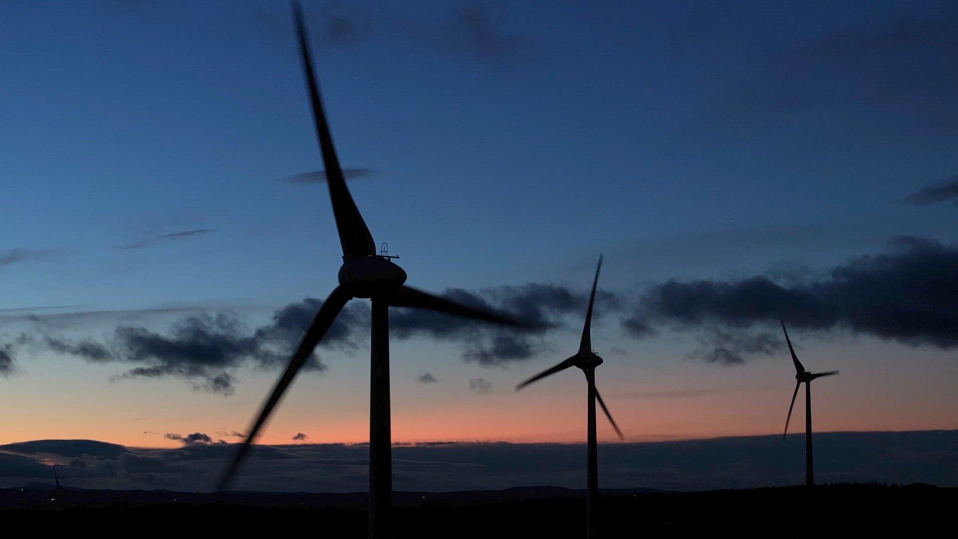 Wind Farm Turbine Operating at Night Generating Renewable Power