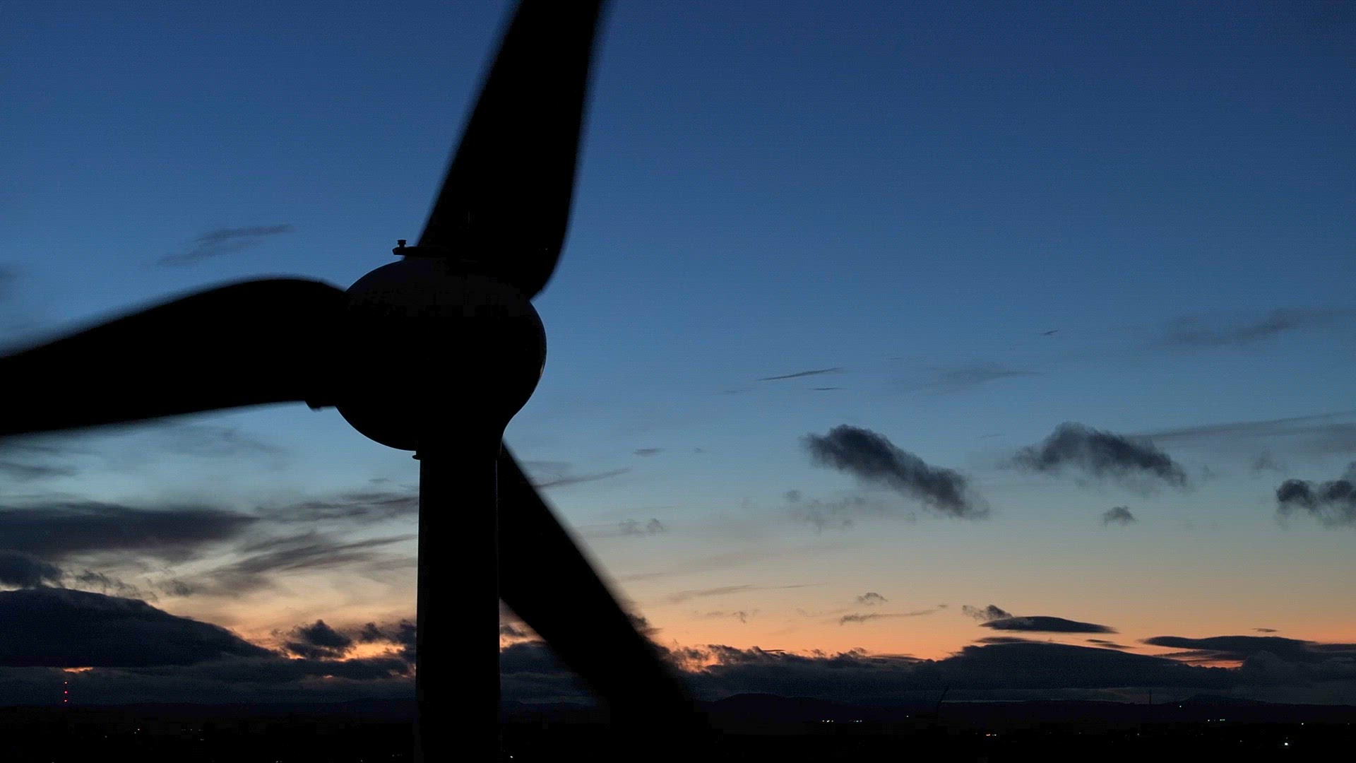 Wind Farm Turbines Generating Renewable Energy Through the Night