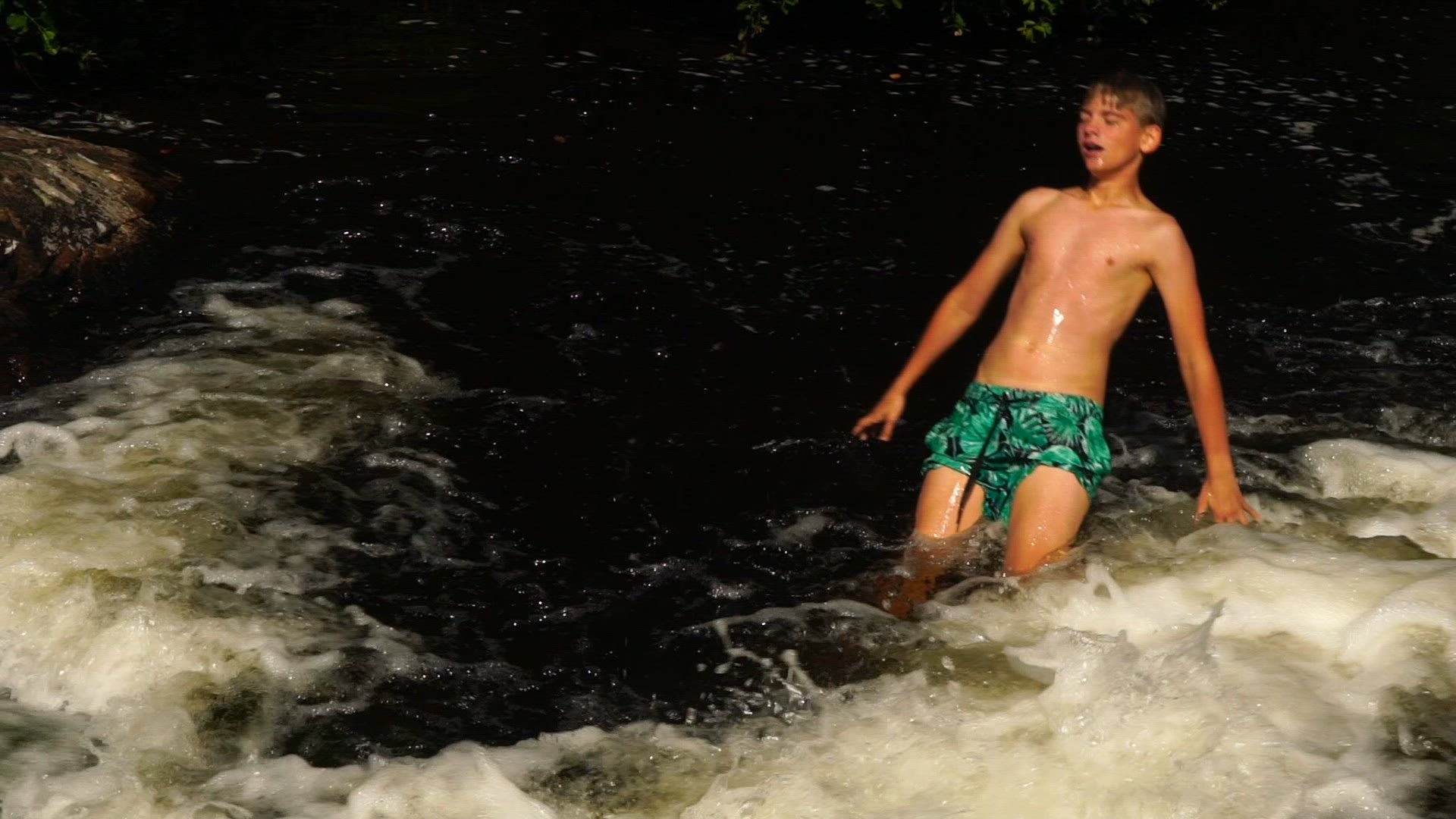 boy playing in rapids - 3.mp4