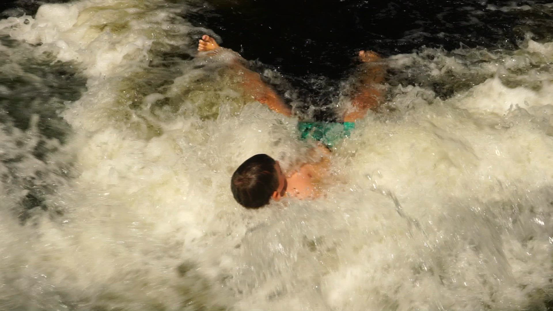 boy in rapids - flexing muscles.mp4