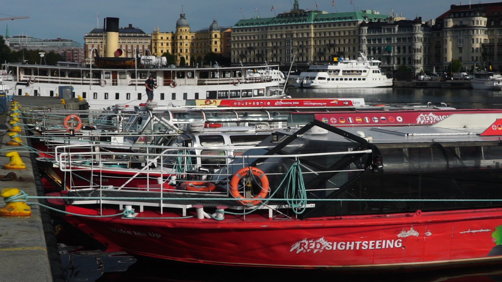 slow motion shot of sightseeing boats at quay in Stockholm.mp4