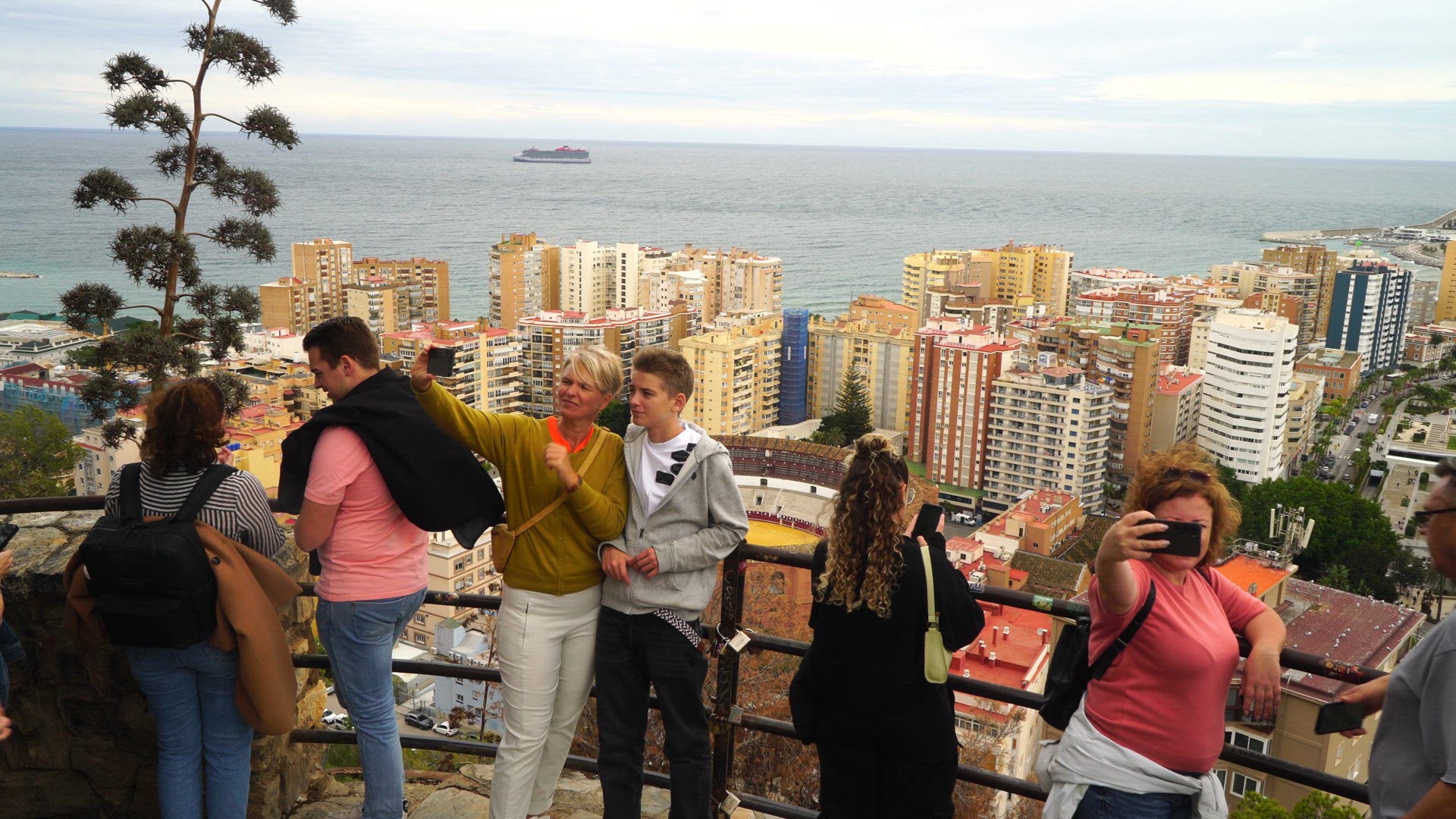taking selfies - Malaga skyline in background.mp4