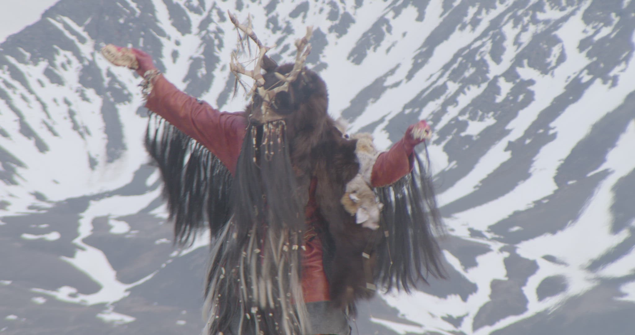 inuit hunter performing fire ceremony