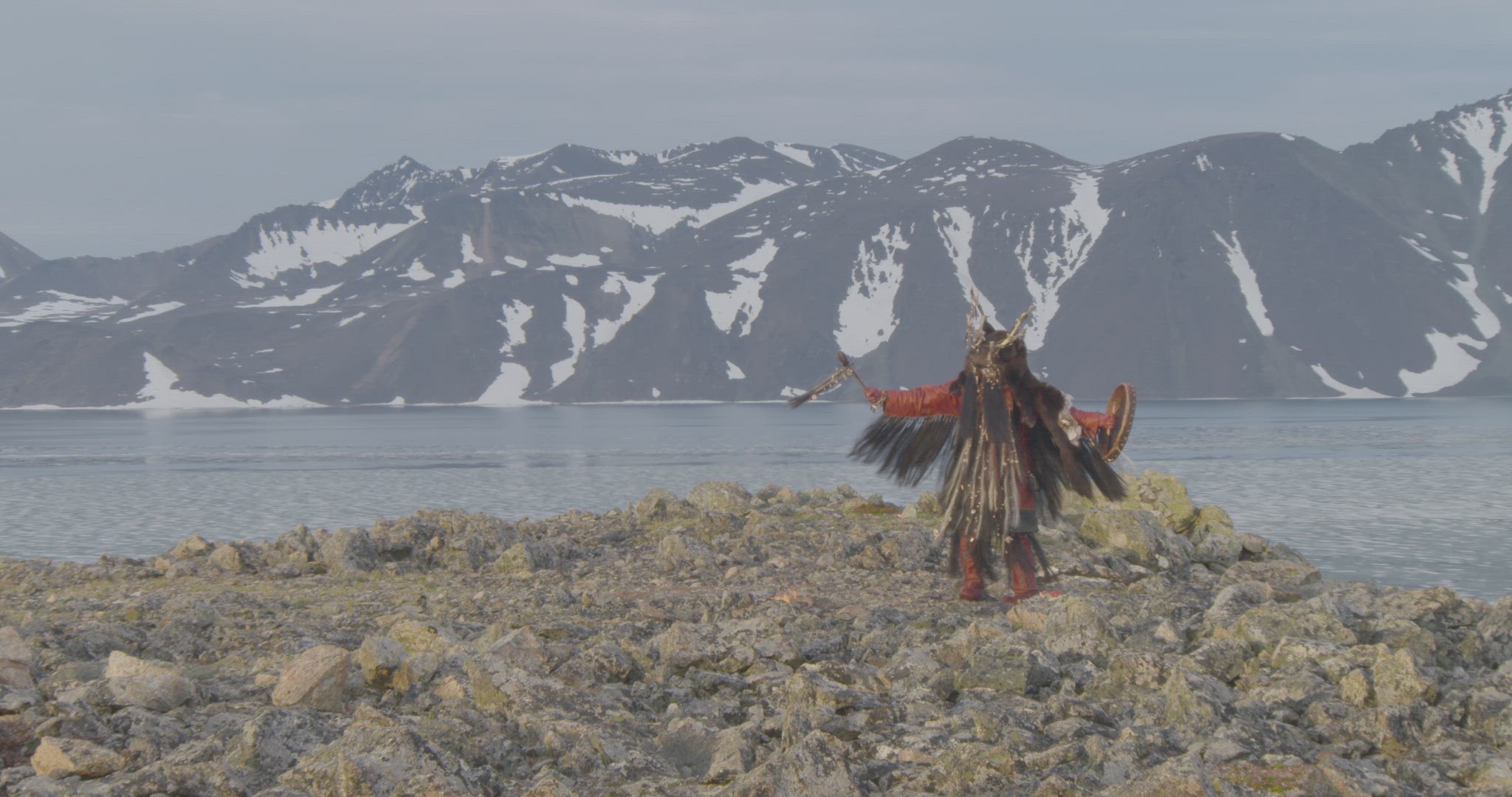 inuit hunter performing fire ceremony