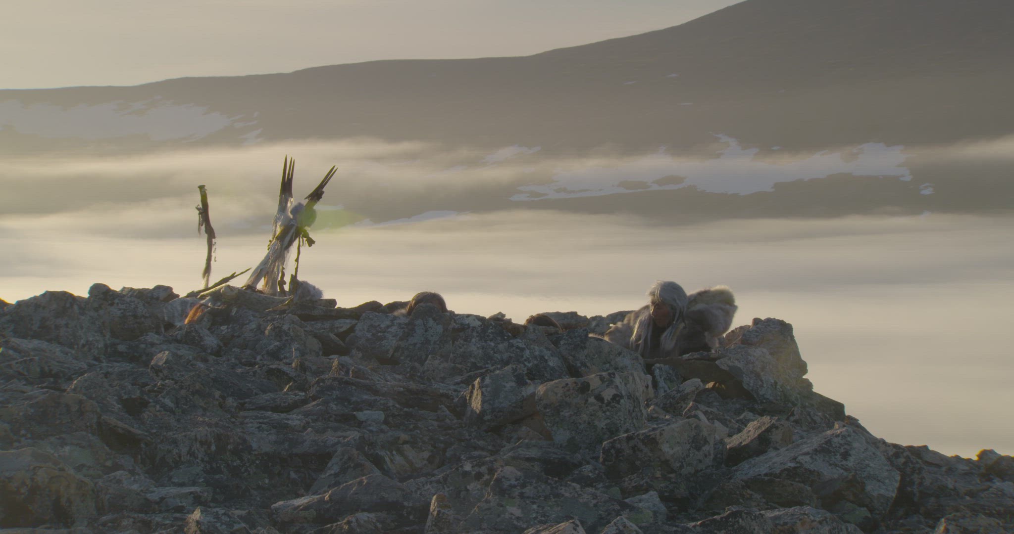 nomadic hunters sheltering on mountaintop