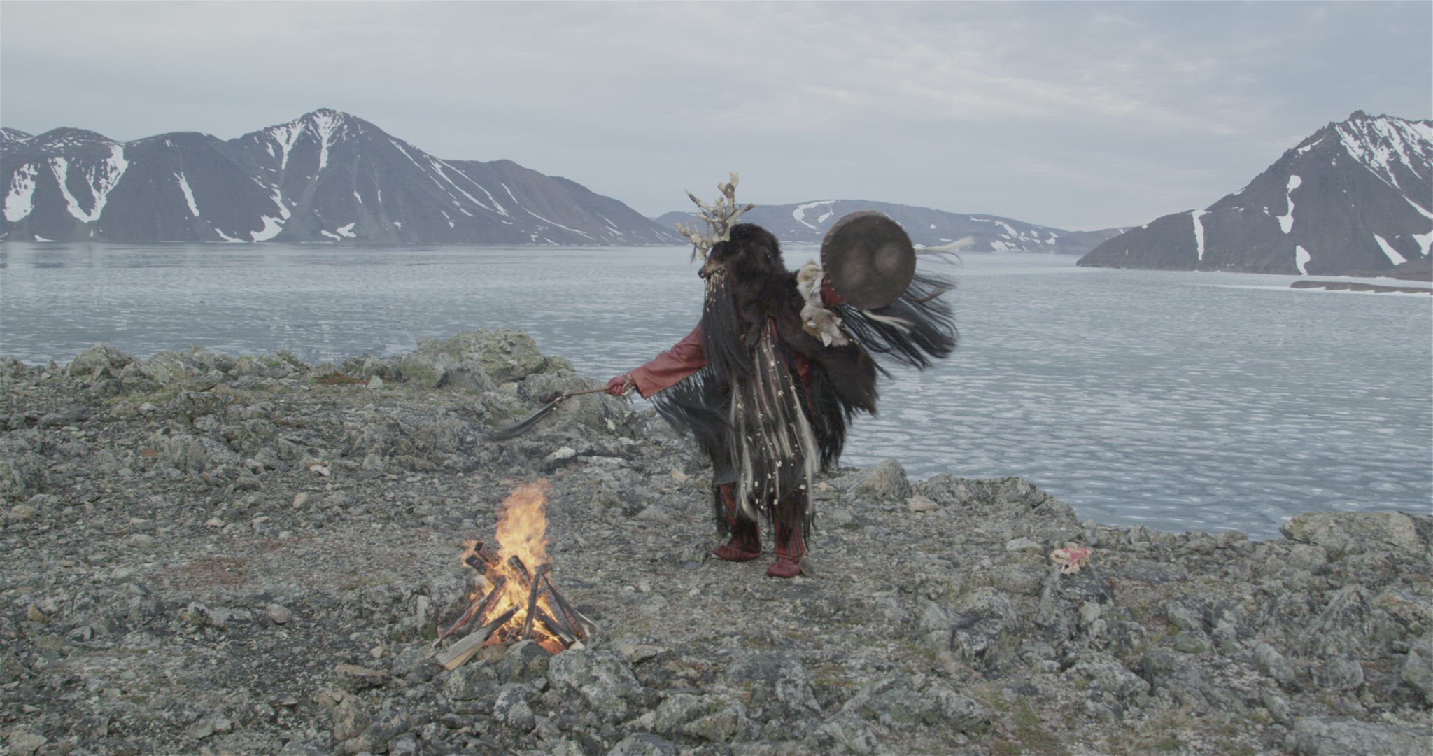 inuit hunter performing fire ceremony
