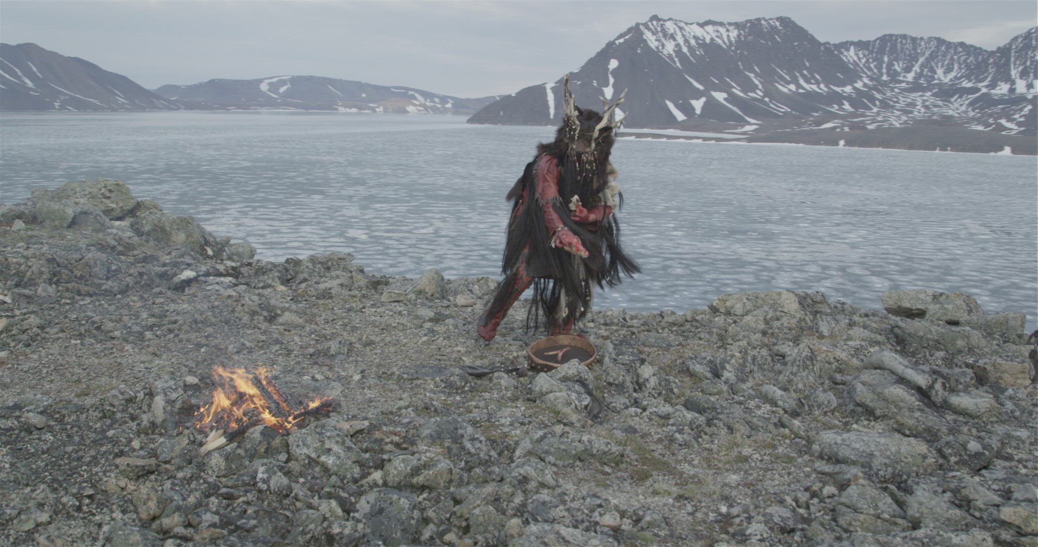inuit hunter performing fire ceremony