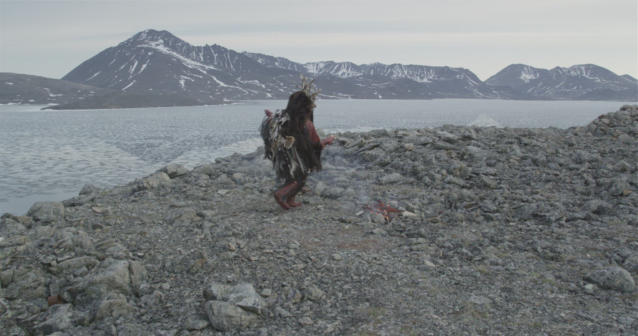 Inuit hunter performing fire ceremony