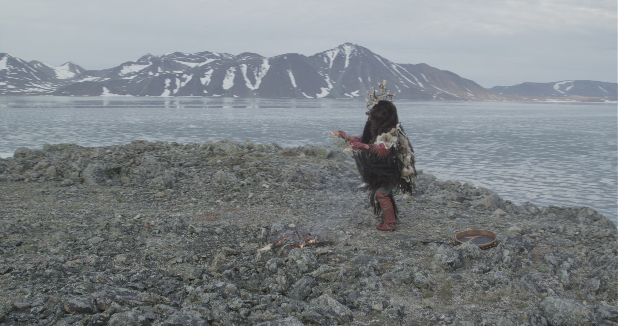 Inuit hunter performing fire ceremony