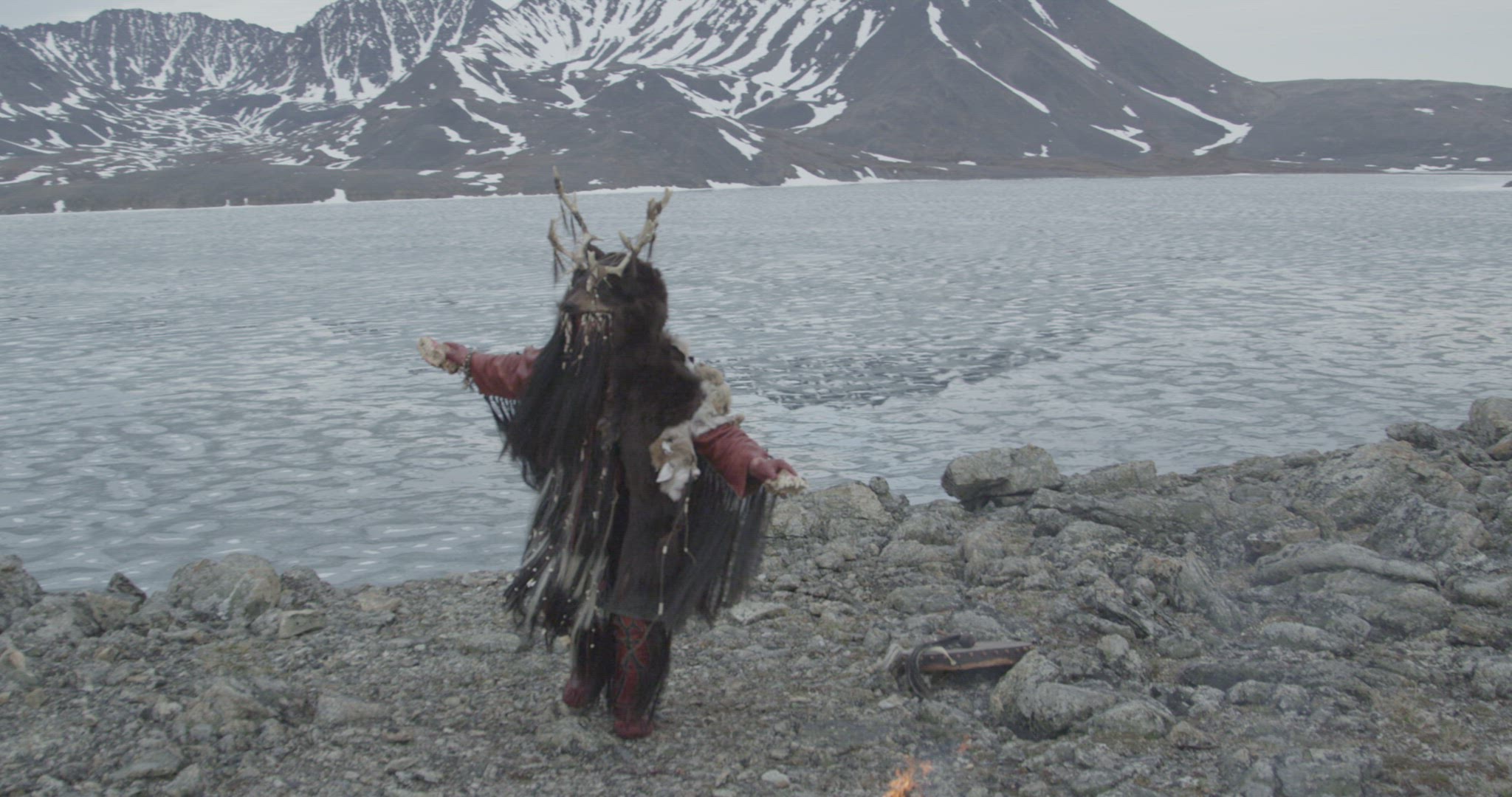 Inuit hunter performing fire ceremony