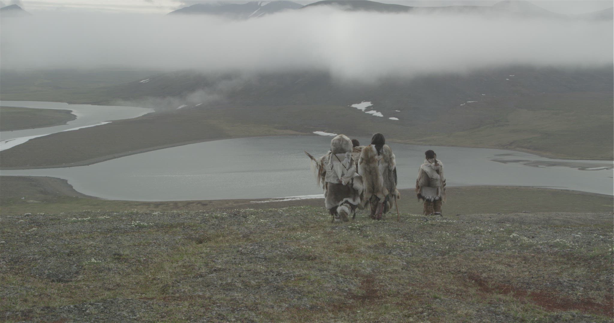 samurai hunters walking on mountain ridge