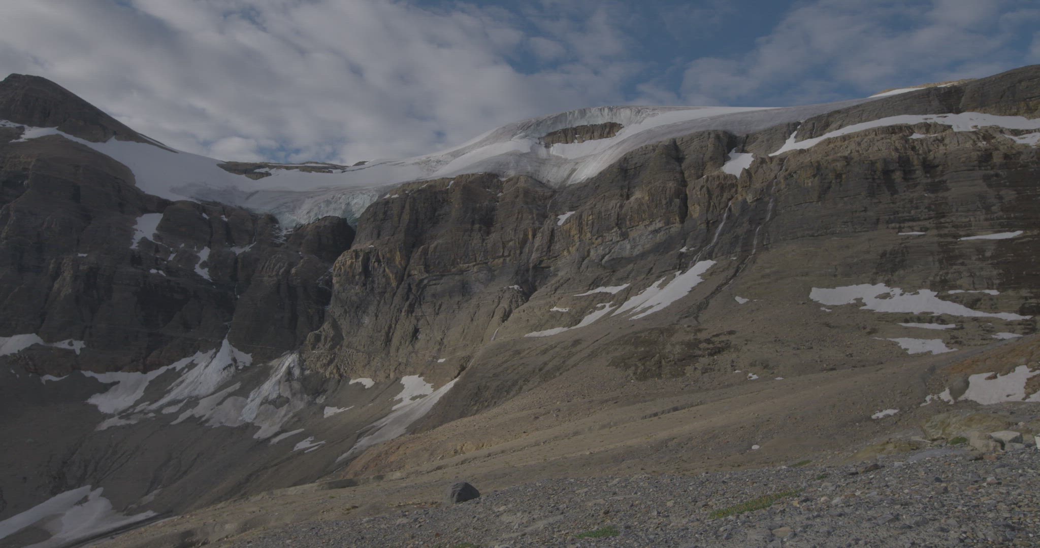 mountain top with glacier and valley below