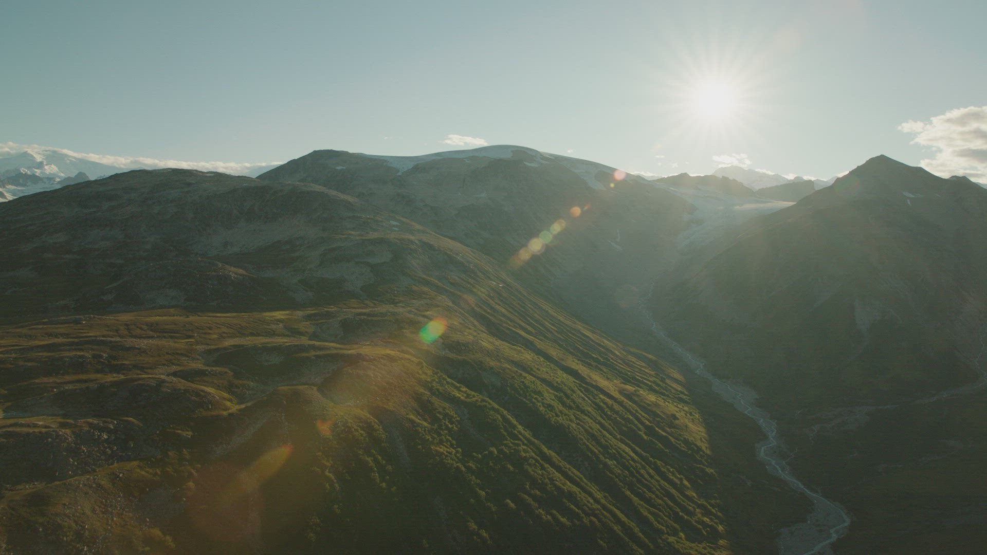 reveal shot over hill of mountains and glaciers