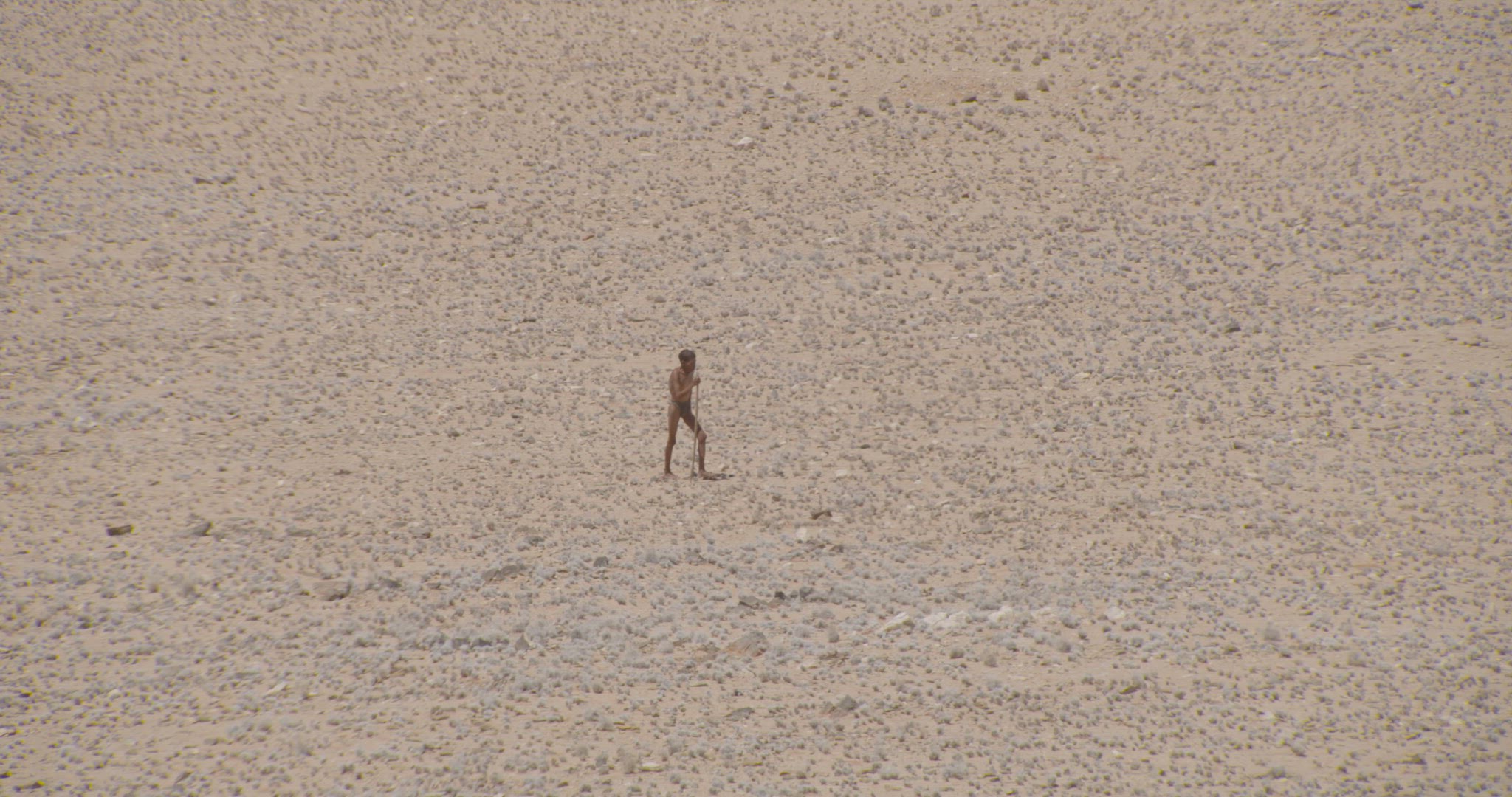 male walking alone in desert