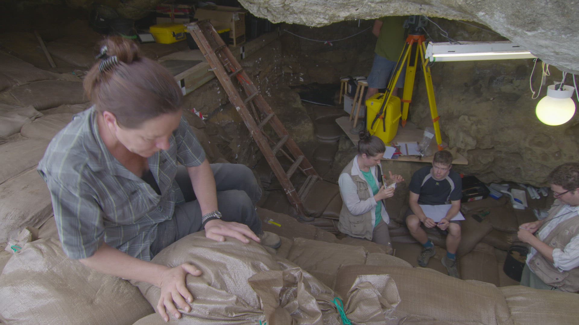 archaeologists inside dig site
