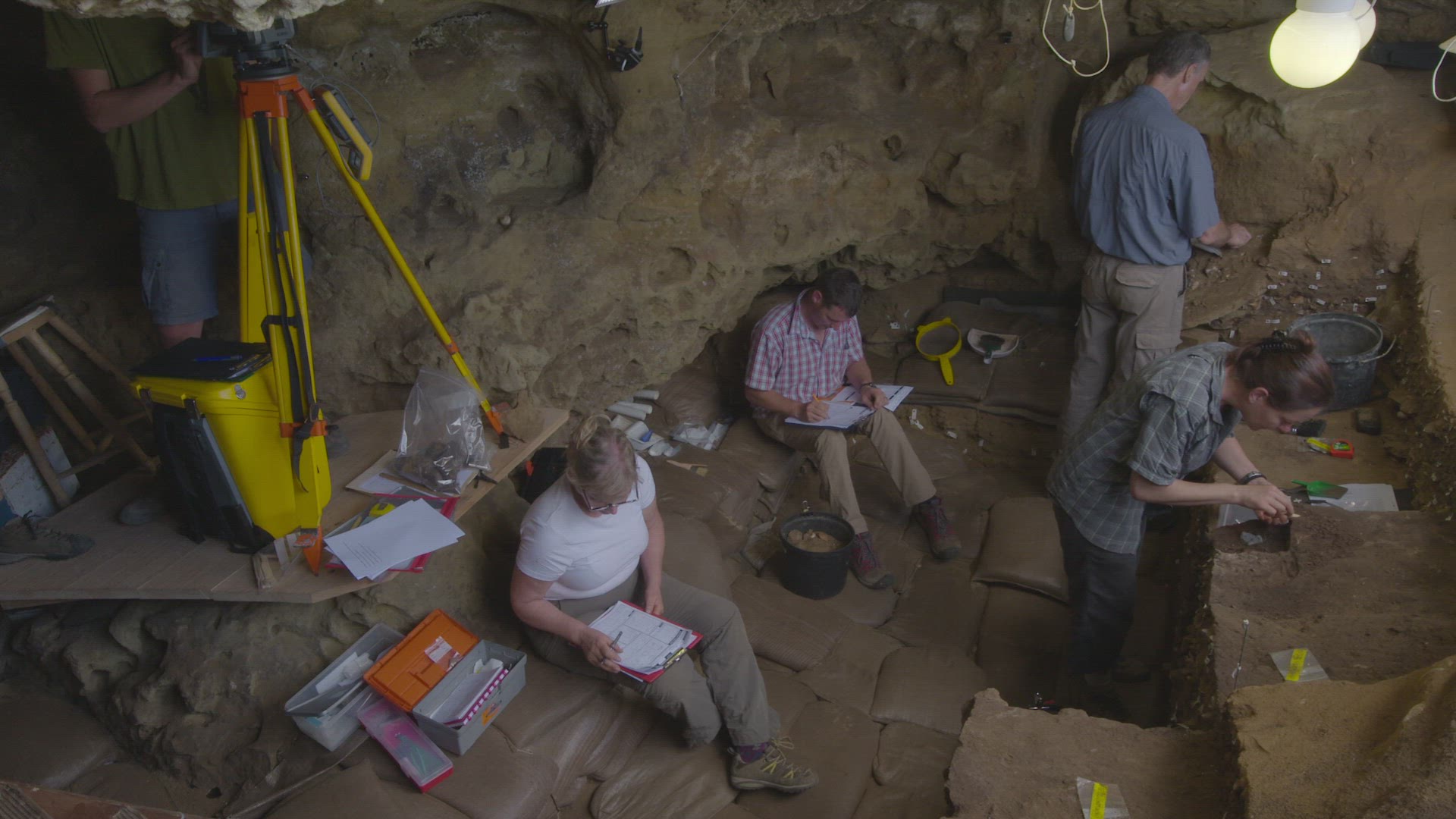 archaeologists inside dig site