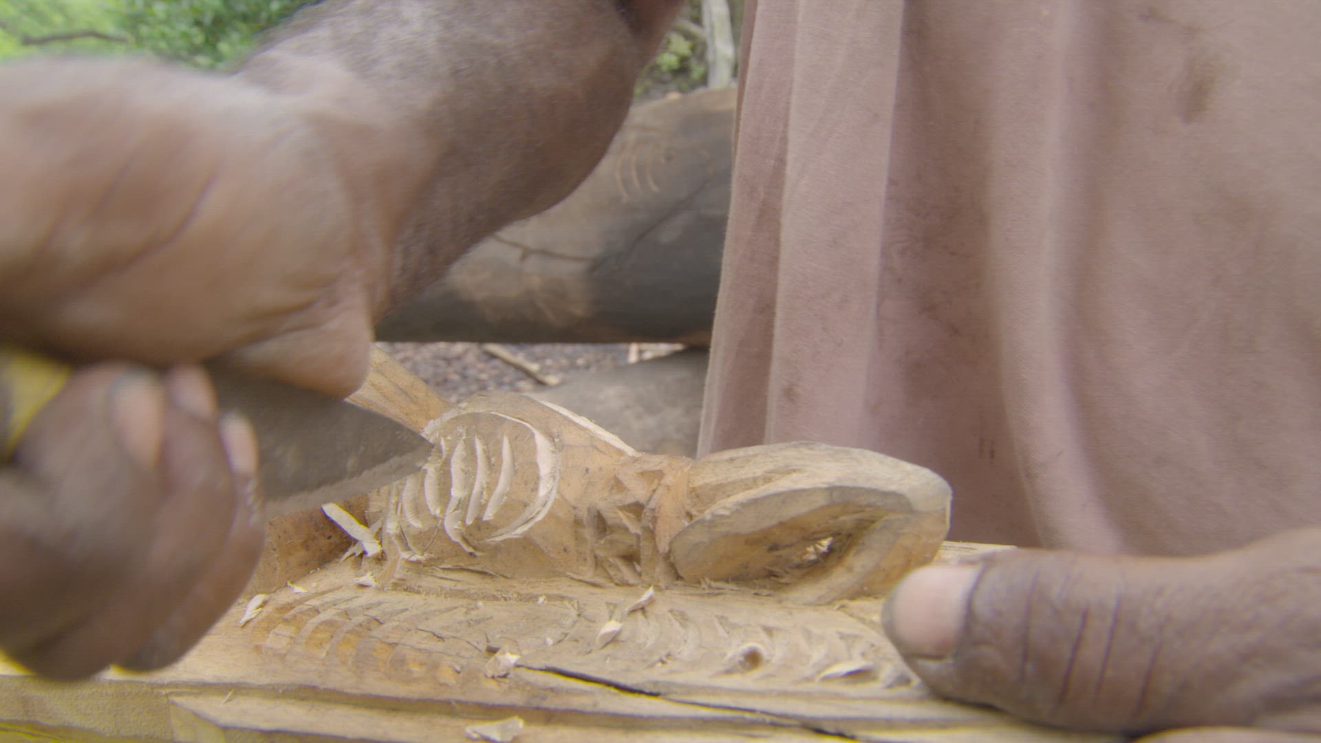 detailed carving of wooden canoe
