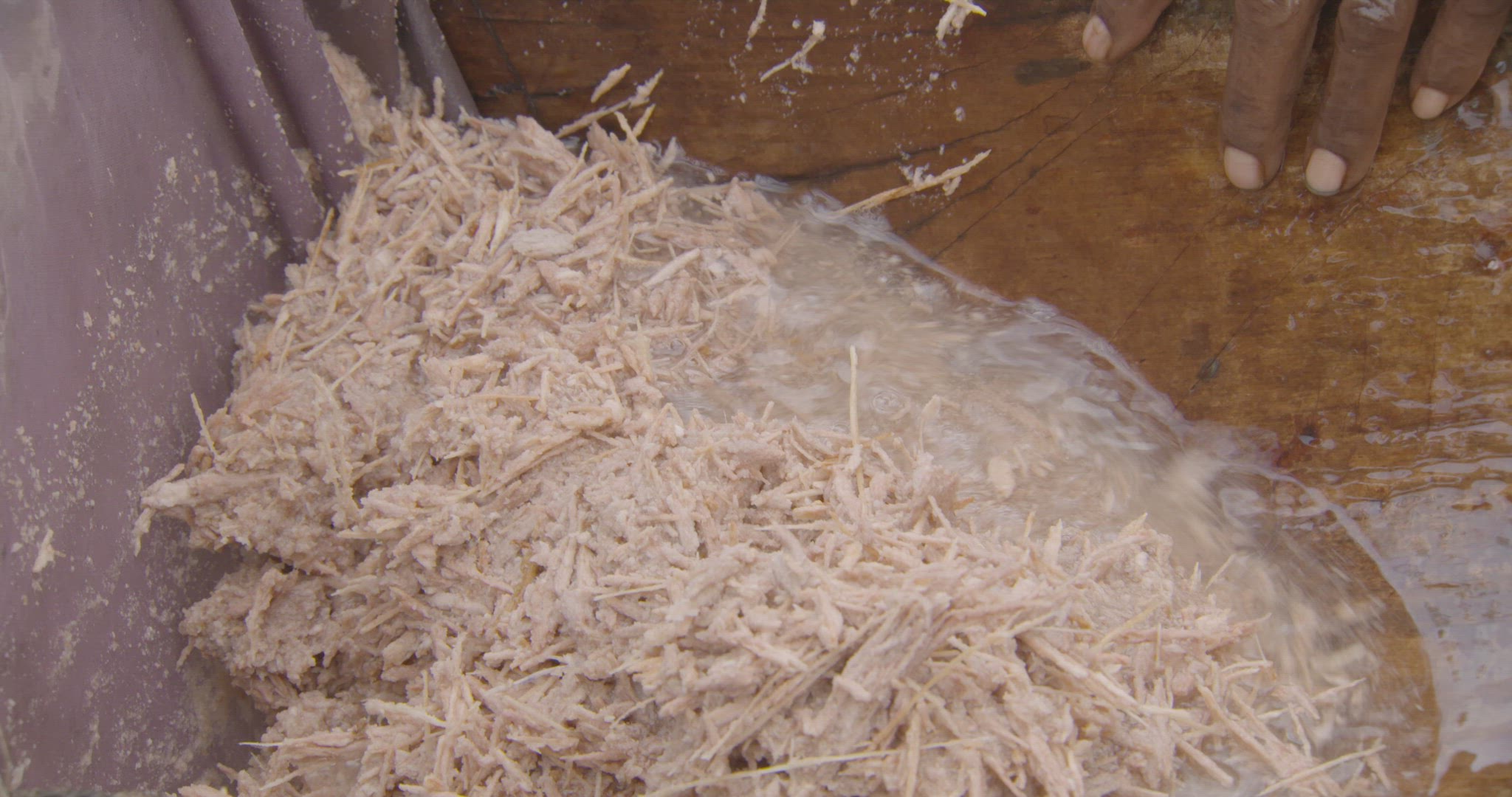 pouring water over shards of bark