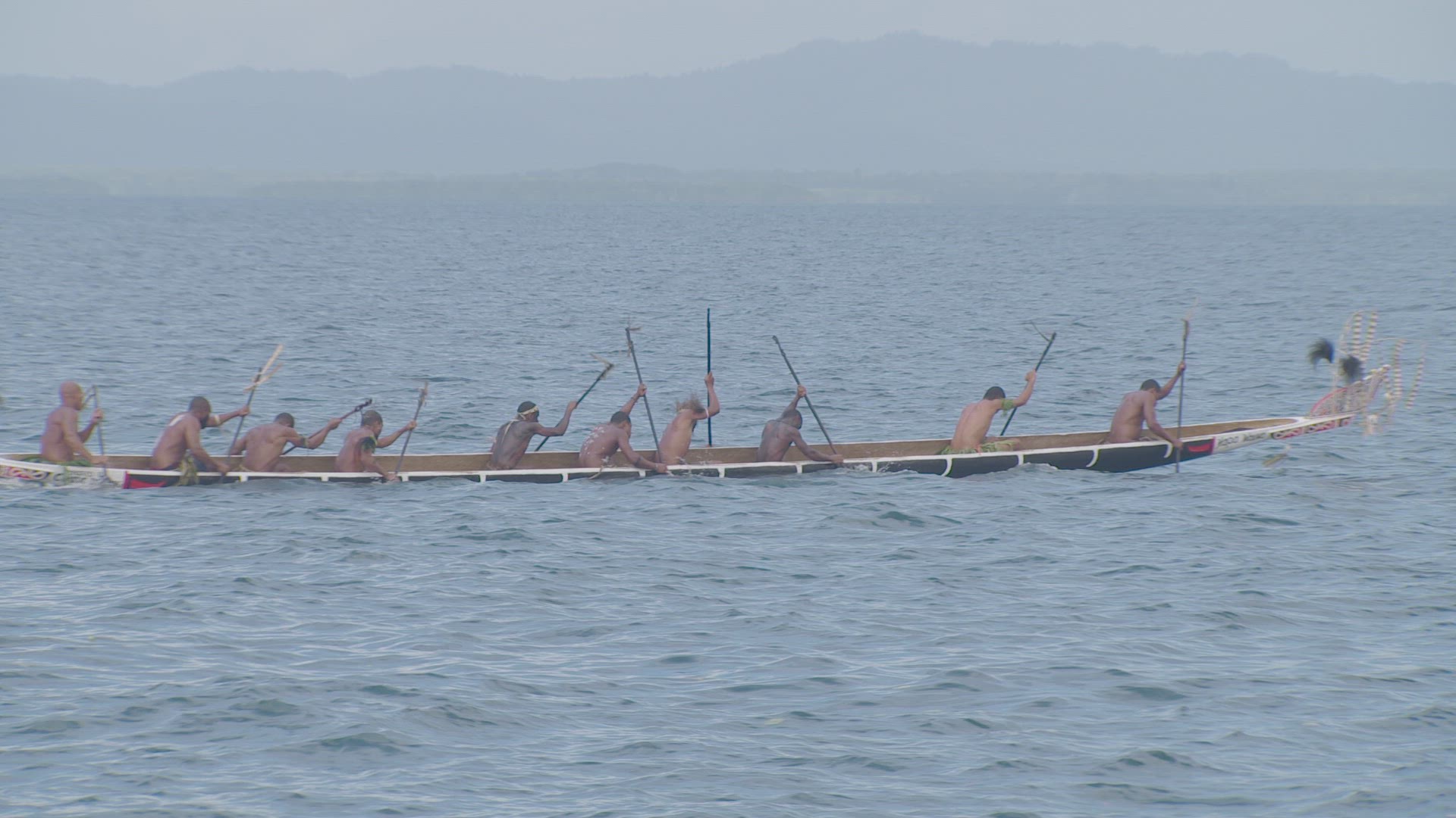 war canoe on water