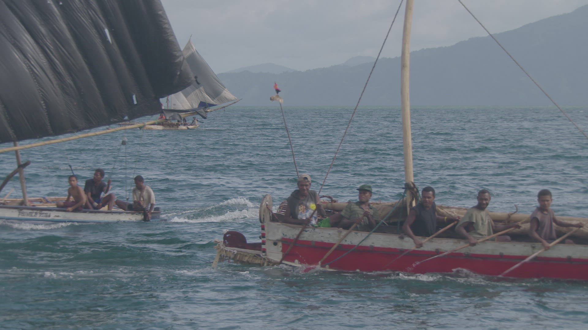 wooden war canoe on water