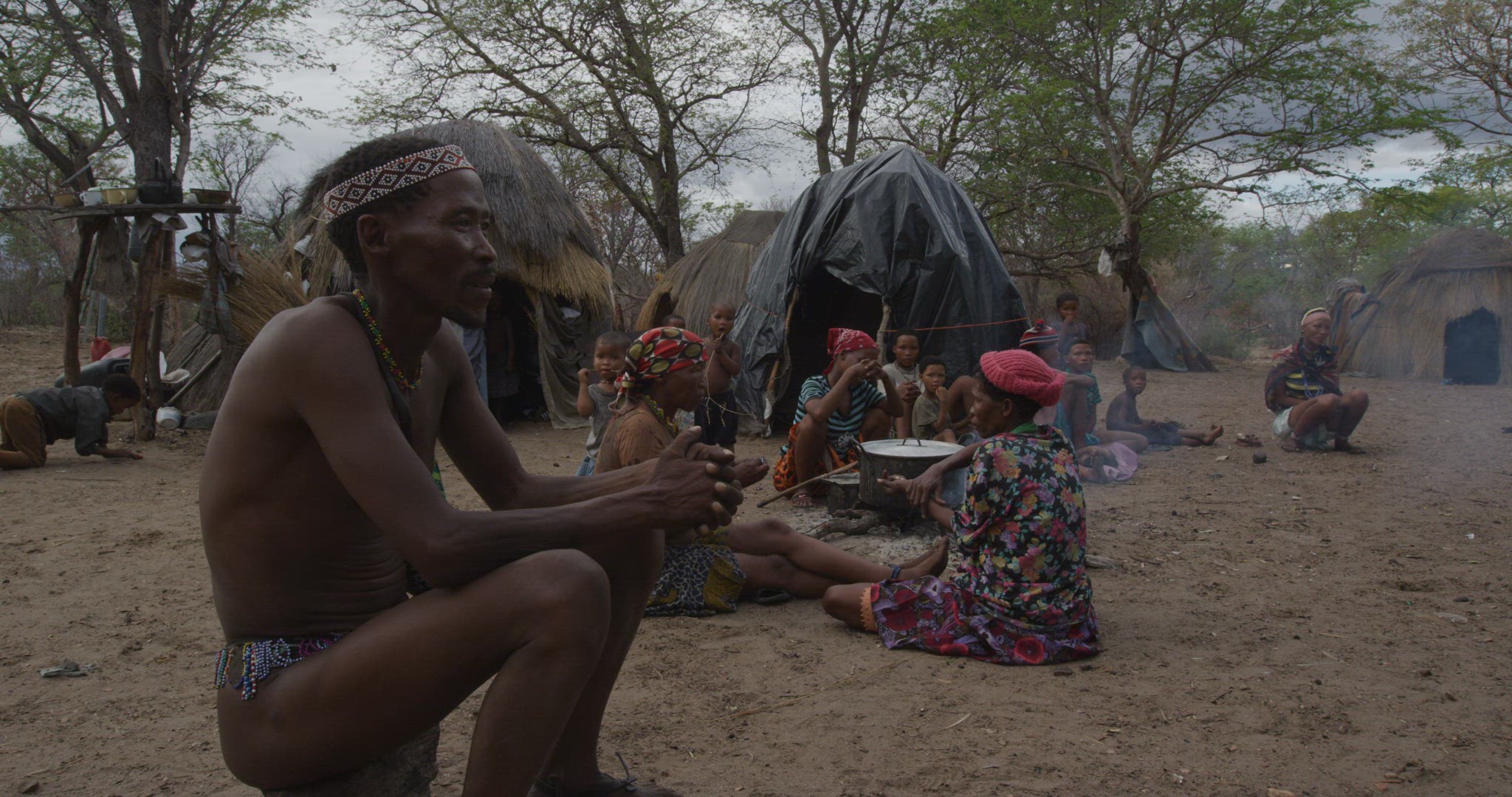 following tribal leader into village