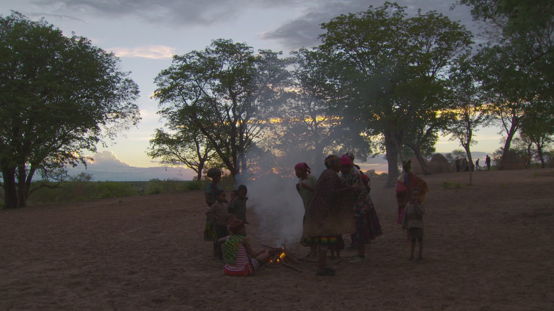 San woman preparing fire