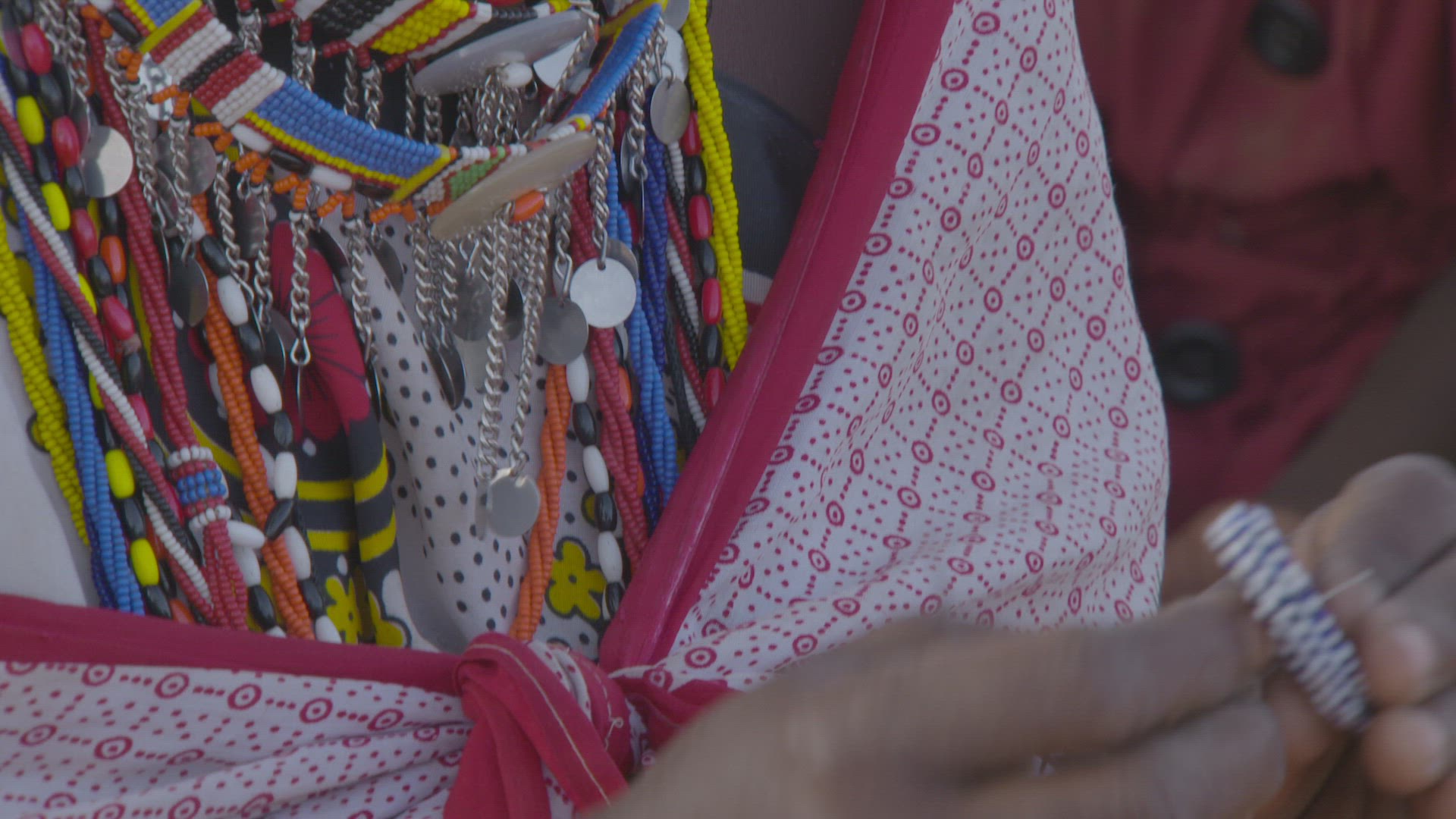 women hand beading jewelry