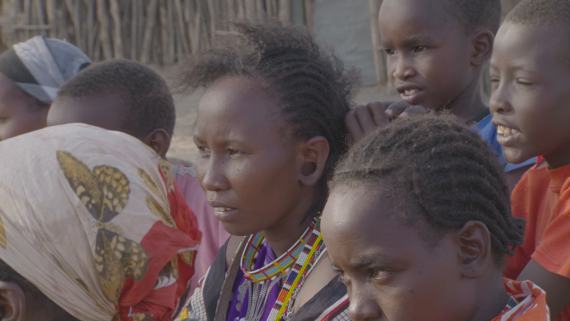 maasai woman having hair braided