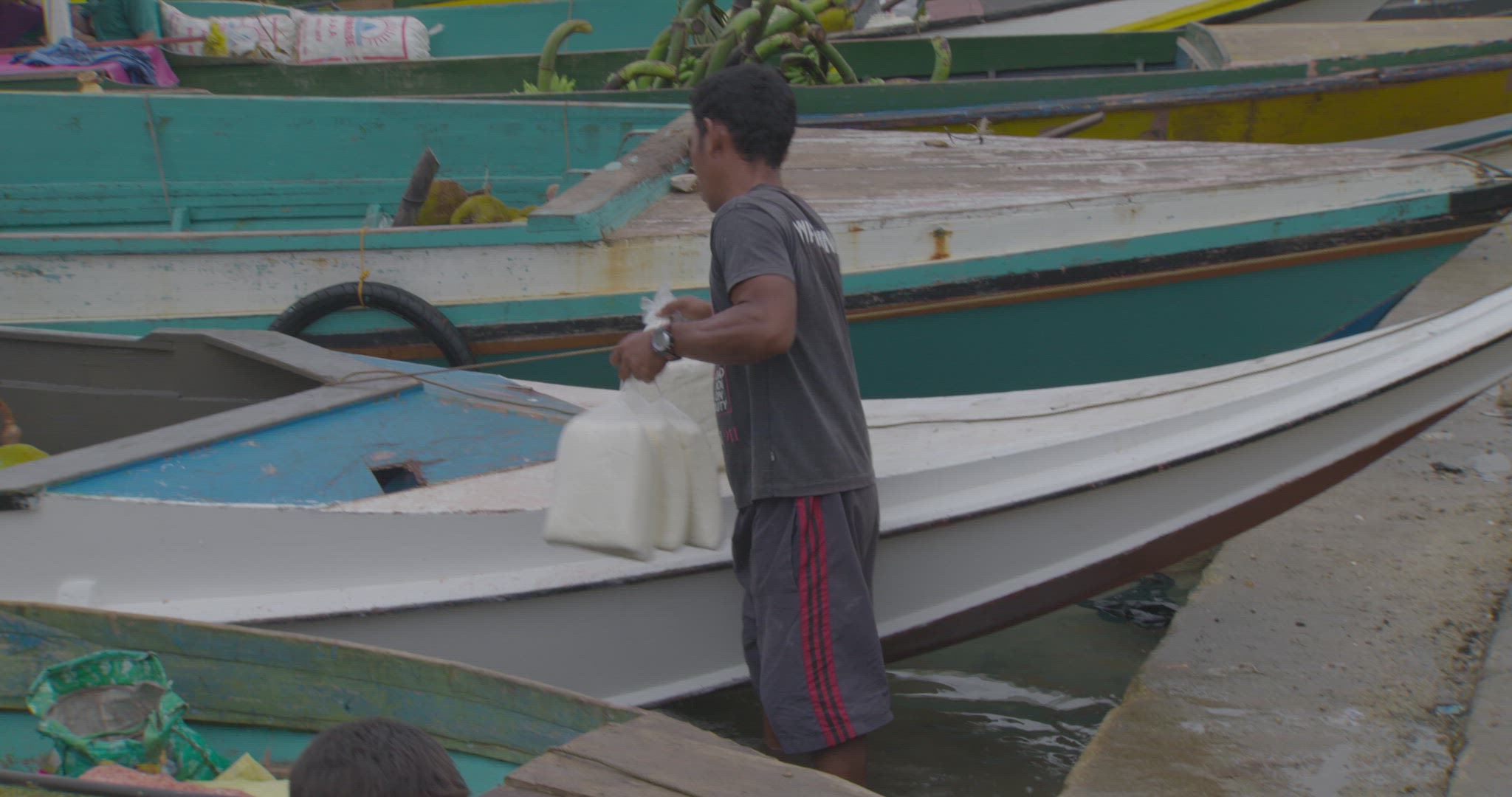 boat being unloaded at sea market