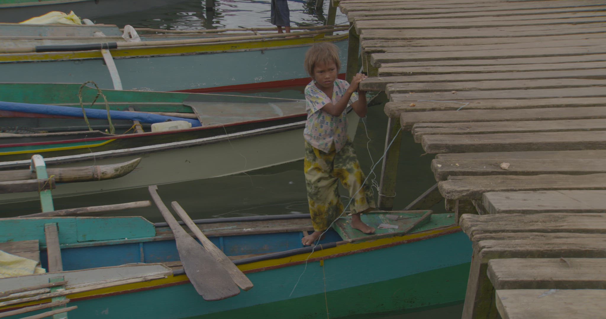 people sitting inside boats at dock