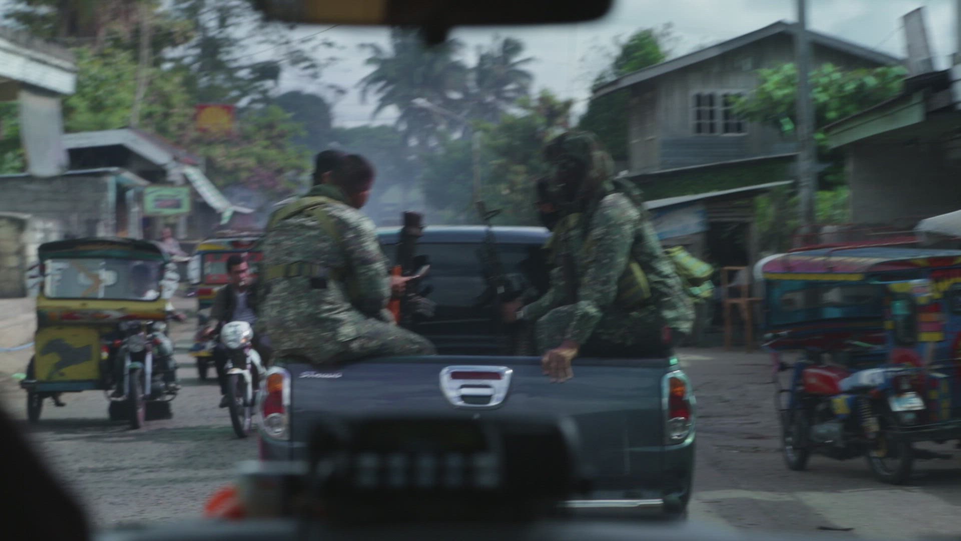 special forces team riding in a truck bed