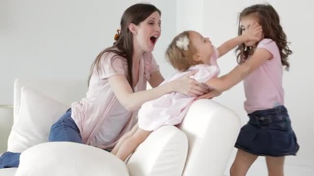 Two Caucasian sisters fighting