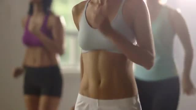 Midsection of caucasian women jogging in place