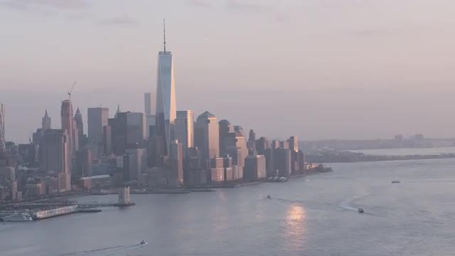 AERIAL MEDIUM to WIDE ZOOM OUT view of Downtown Manhattan from New Jersey