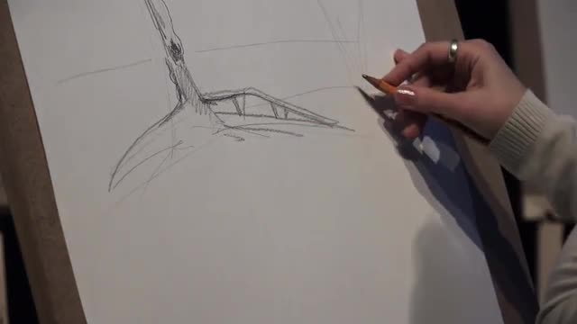The artist paints a picture of a pencil. 4K.