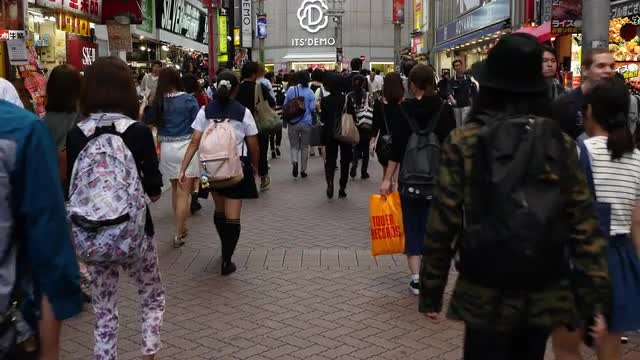 Pan Down of Busy Shibuya Shopping District Daytime - Tokyo Japan