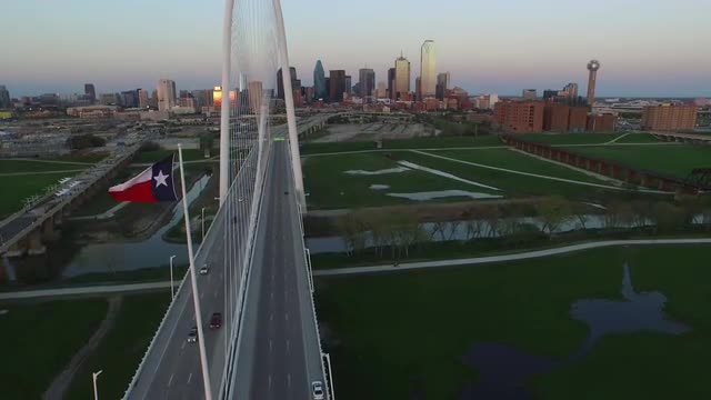 The Texas State Flag and The Margaret Hunt Hill Bridge over Singleton Boulevard in Downtown Dallas